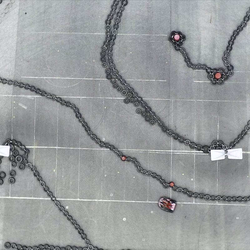 Aerial view of the karting track with moving small red karts, race and motorsport concept. Media